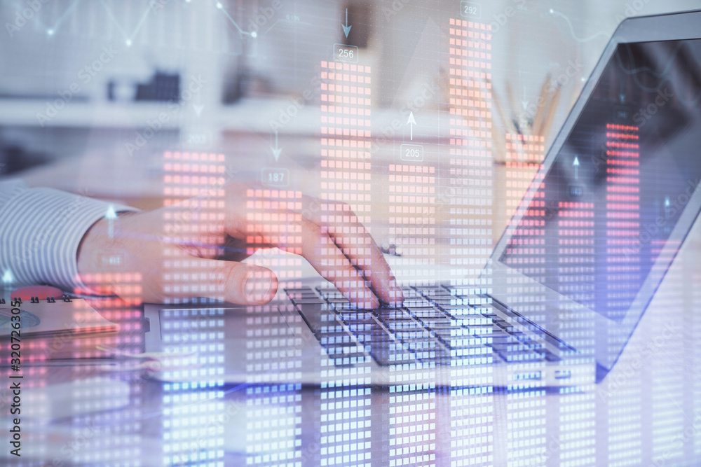 Double exposure of stock market graph with man working on laptop on background. Concept of financial analysis. Double exposure of stock market graph with man working on laptop on background. Concept of financial analysis.
