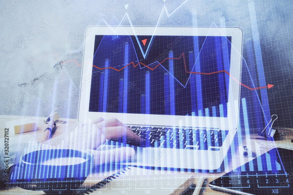 Forex graph with businessman working on computer in office on background. Concept of hardworking. Double exposure. Forex graph with businessman working on computer in office on background. Concept of hardworking. Double exposure.