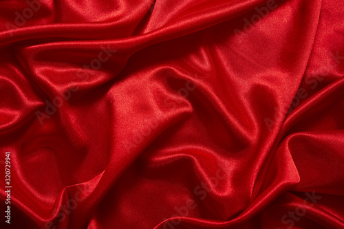 Luxury red satin smooth fabric background for celebration, ceremony, event invitation card or advertising poster