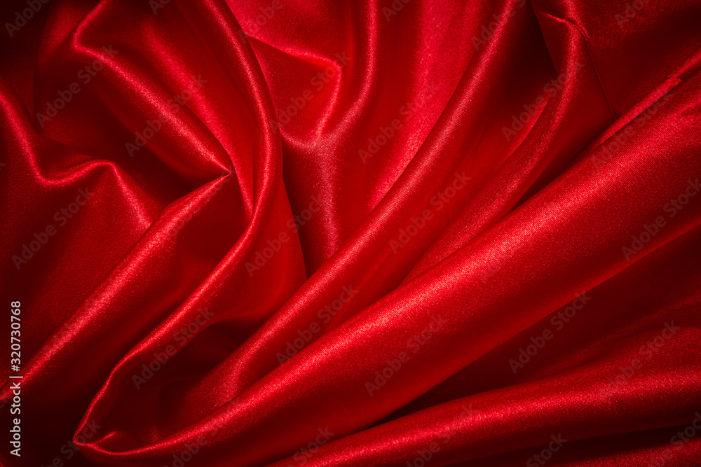 Luxury red satin smooth fabric background for celebration, ceremony, event invitation card or advertising poster Luxury red satin smooth fabric background for celebration, ceremony, event invitation card or advertising poster