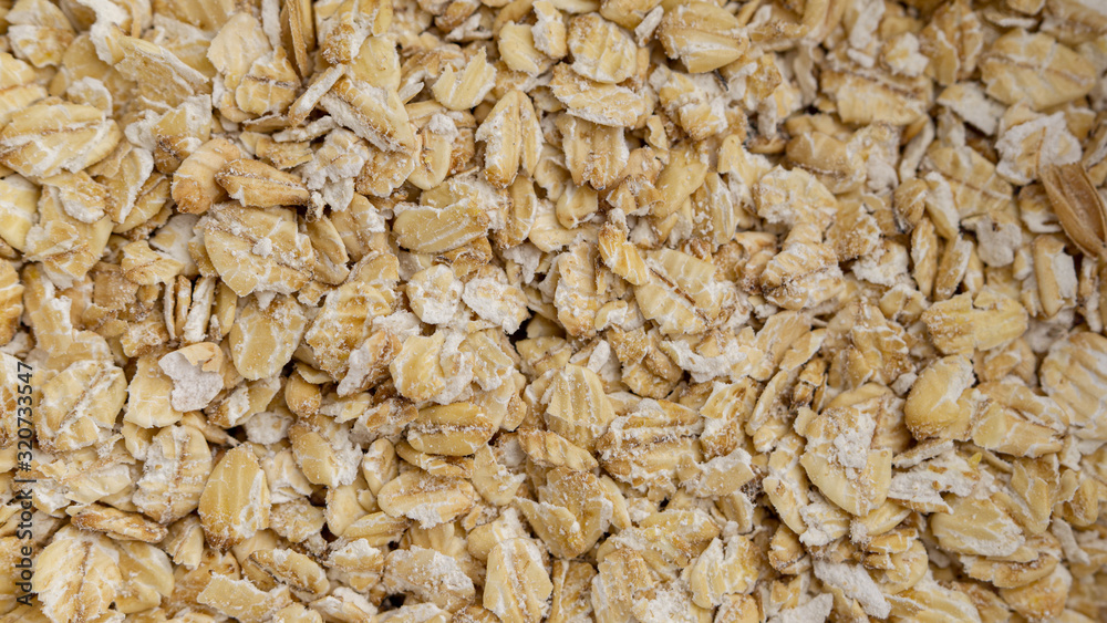 Oatmeal flakes background photo. Macro, full frame Oatmeal flakes background photo. Macro, full frame