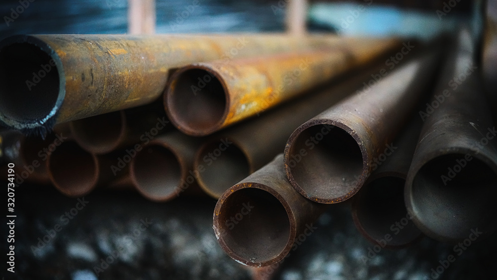 art photo of long metal pipes in perspective with a blurry background with beautiful natural light art photo of long metal pipes in perspective with a blurry background with beautiful natural light