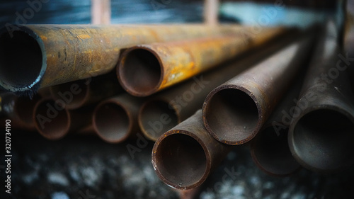 art photo of long metal pipes in perspective with a blurry background with beautiful natural light