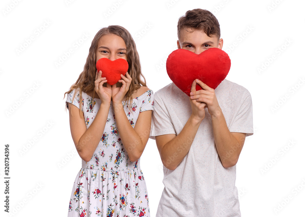Portrait of sweet young couple in love. Happy teen boy and girl ...