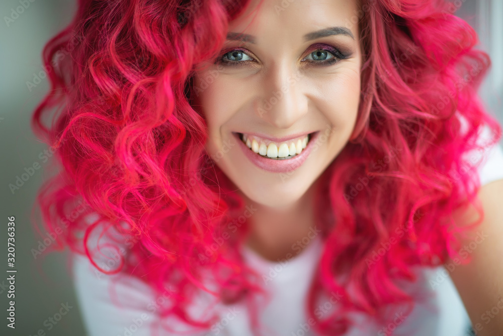 Beautiful woman with bright hair color. 