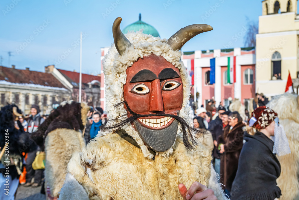 Unidentified people in masks; participants at the Mohacsi Busojaras, it is a carnival for spring greetings (Intangible Cultural Heritage of Humanity of the UNESCO).