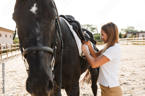 Beautiful woman with horse in countryside