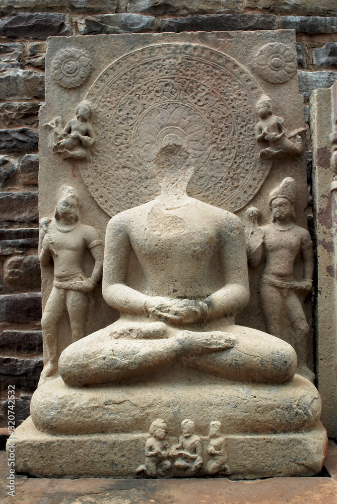 Defaced Buddha statue inside Stupa 1, Sanchi, Madhya Pradesh, India. 