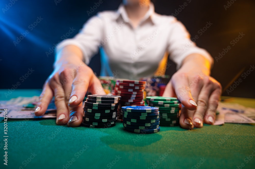 A game in a casino, a player plays poker, raising bets, risk. A business game A game in a casino, a player plays poker, raising bets, risk. A business game