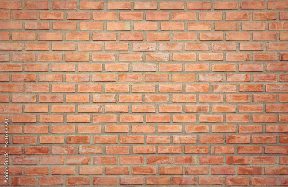 Old Orange brick wall concrete or stone texture background, wallpaper limestone abstract to flooring and homework/Brickwork or stonework clean grid uneven interior rock old. Copy space. Old Orange brick wall concrete or stone texture background, wallpaper limestone abstract to flooring and homework/Brickwork or stonework clean grid uneven interior rock old. Copy space.