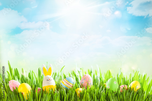 Easter eggs on meadow. Easter concept.