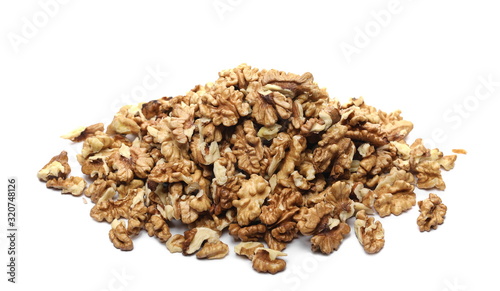 Unshelled walnuts pile isolated on white background