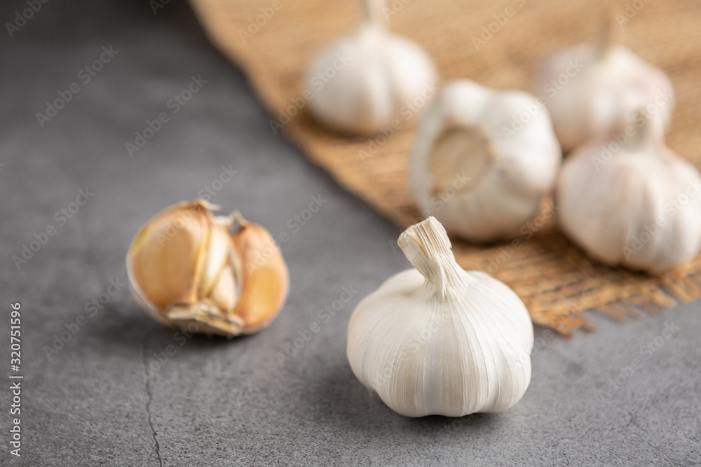 Garlic on the black table. High angle view. Garlic on the black table. High angle view.