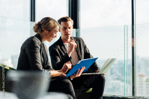 Corporate business team meeting discussion and startup concept. Coworking team meeting. Group of two businesspeople working with new startup project in modern office.