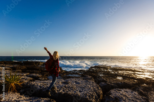 Photo of Blonde Woman at Stormy Sea