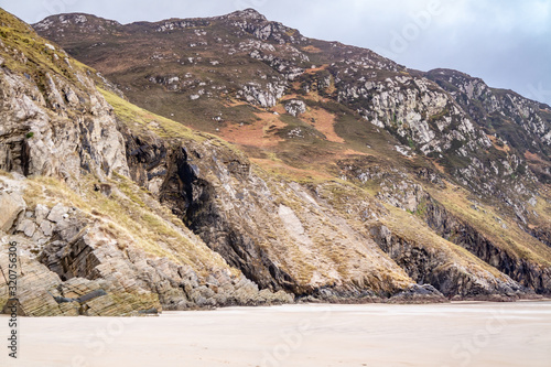 The beach and caves at Maghera Beach near Ardara, County Donegal - Ireland.