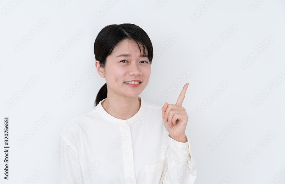 young woman pointing at something young woman pointing at something