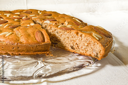 Zelten, rustic South Tyrolean cake on white tablecloth. photo