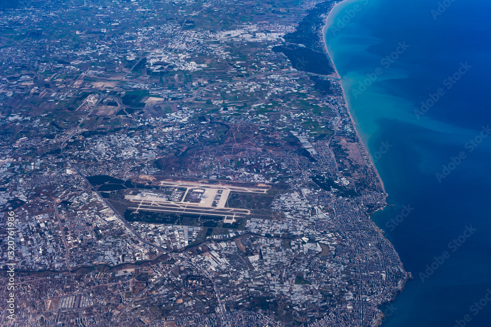 Fototapeta premium Aerial view over Antalya, Antalya Airport, Lara Beach, the Gulf of Antalya, and the Levantine Sea