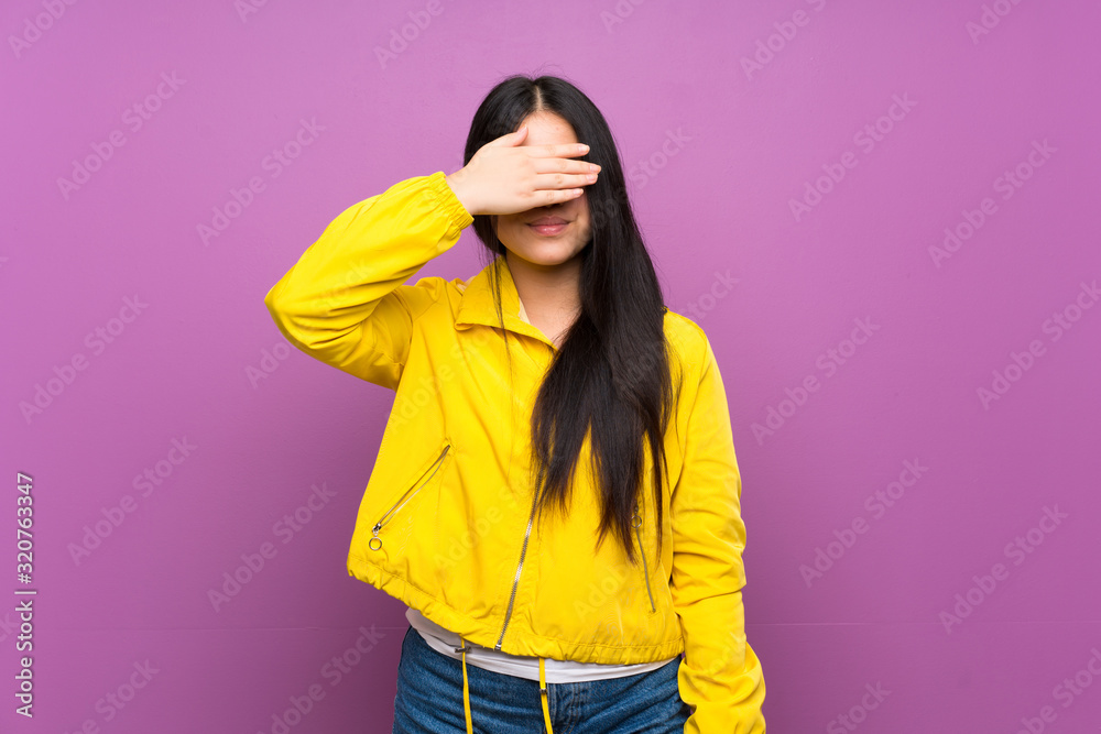 Young teenager Asian girl over isolated purple background covering eyes by hands. Do not want to see something Young teenager Asian girl over isolated purple background covering eyes by hands. Do not want to see something
