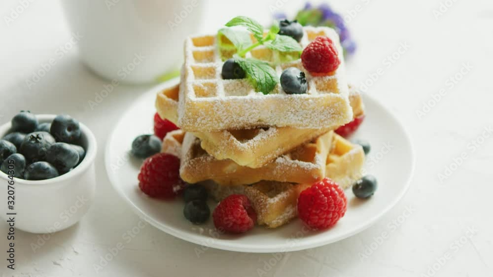 Waffles on plate and cup of coffee Waffles on plate and cup of coffee