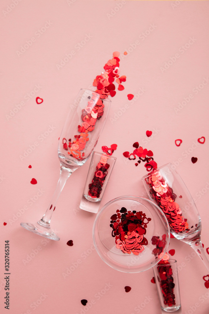 Valentine's day drinks glasses with red heart confetti. Valentine's day drinks glasses with red heart confetti.