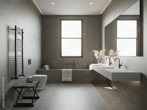 Atmospheric grey concrete bathroom with bathtub and pampas grass