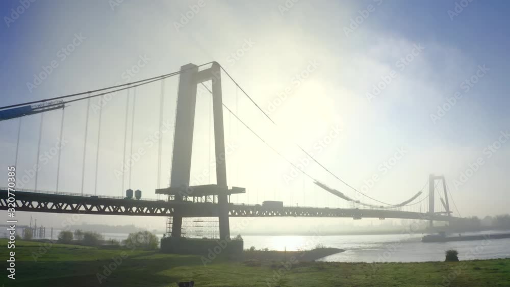 Beautiful Big Suspension Bridge in Emmerich Germany with Golden Sunlight Beautiful Big Suspension Bridge in Emmerich Germany with Golden Sunlight