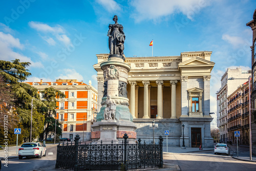 Maria Cristina de Borbon statue with Cason del Buen Retiro on the background photo