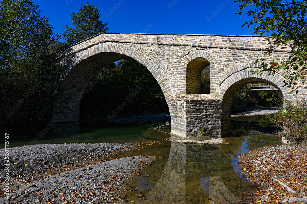 View of the traditional stone bridge of Ziaka near Grevena in northwestern Greece