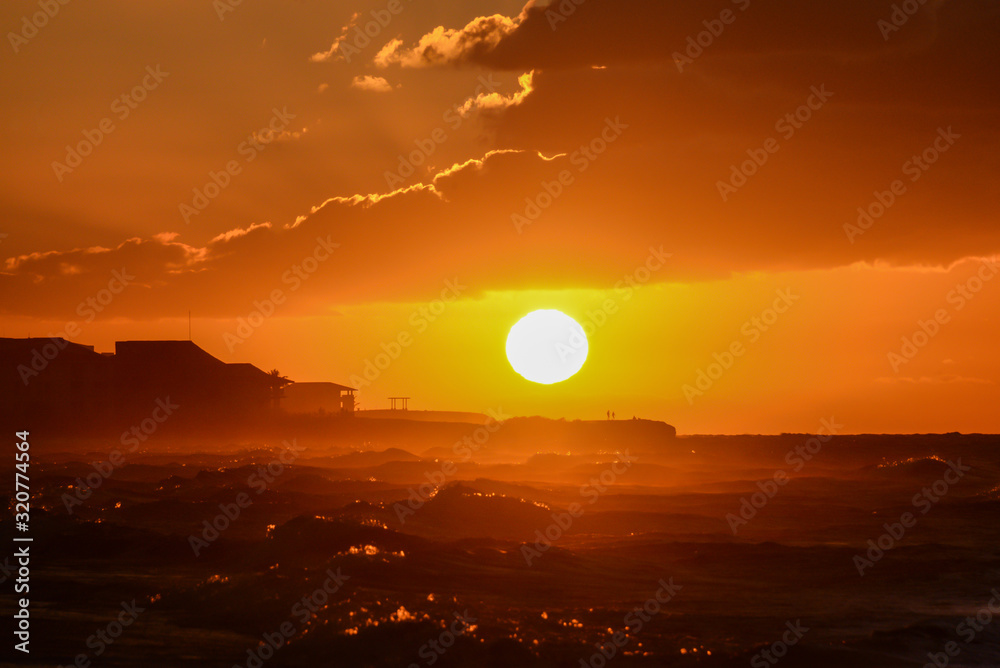 Fototapeta premium Sunset on the beach of Atlantic Ocean, Cuba
