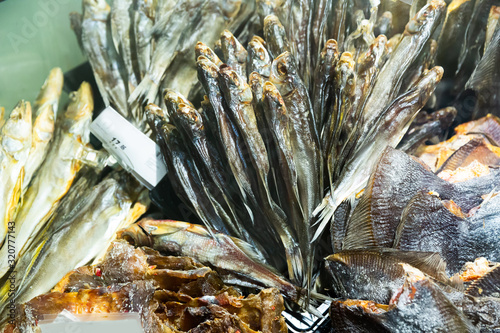 Assortment of cured fish in russian food store photo