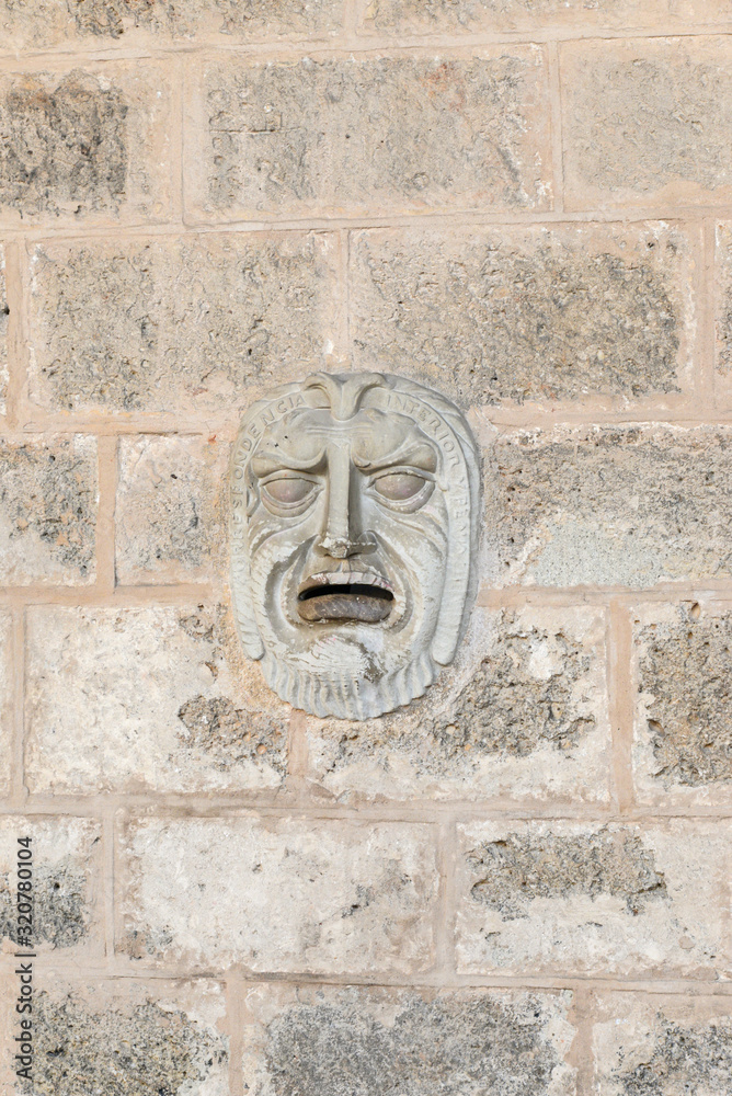 Face on the wall (letterbox) of building in Cathedeal Square in Havana, Cuba Face on the wall (letterbox) of building in Cathedeal Square in Havana, Cuba