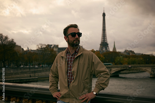 Handsome man enjoying in Paris.