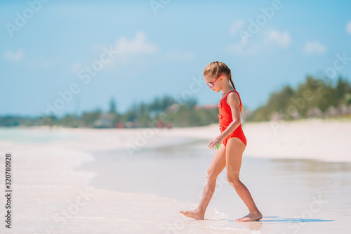 Cute little girl at beach during caribbean vacation © travnikovstudio