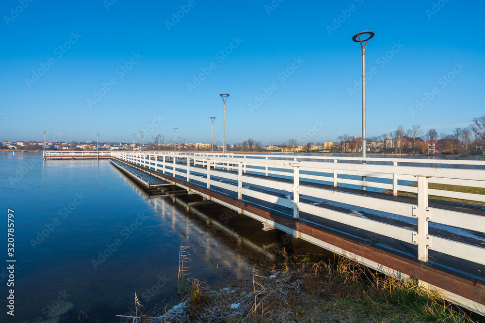 Fototapeta premium A large pier on a small lake in the city of Znin