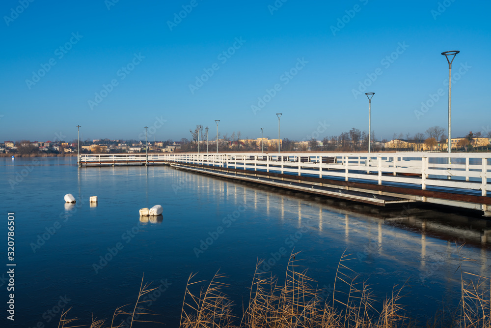 A large pier on a small lake in the city of Znin