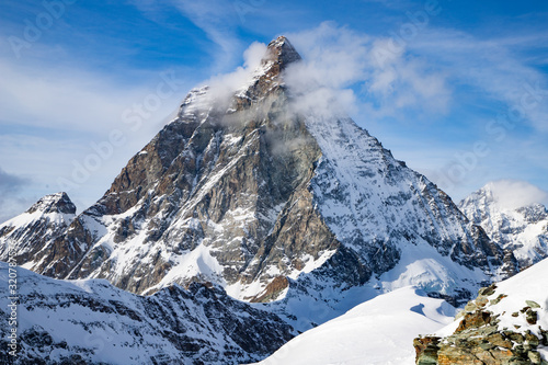 view of Matterhorn peak against blue sky Swiss Alps © Melinda Nagy