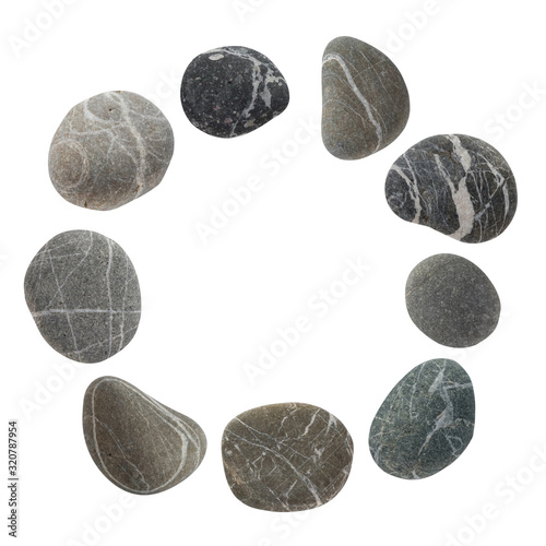 Round frame from a set of different color stones. Stock photo element Scandinavian trend design isolated on white background.