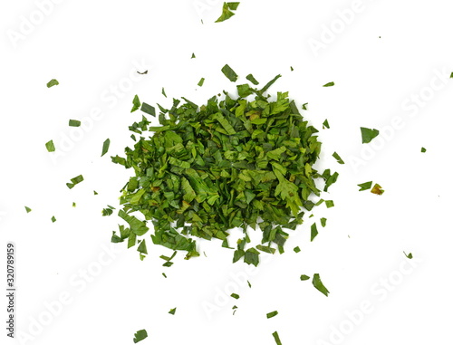 Fresh green chopped parsley leaves isolated on white background and texture, top view. Chopped parsley on a white background isolated. Chopped Parsley Leaves. Fresh Herbs 