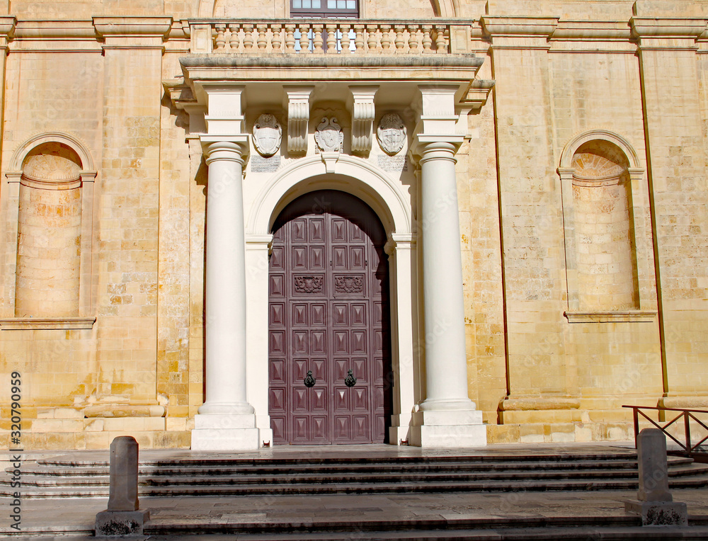 Naklejka premium The grand doorway to the Cathedral in Valletta, Malta