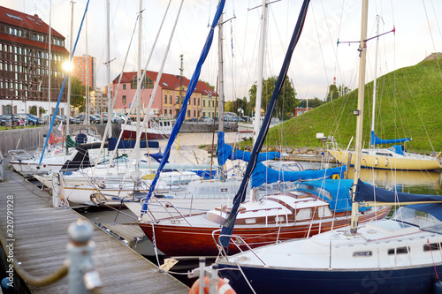 Beautiful yachts by the pier in the yacht club in Klaipeda, Lithuania.
