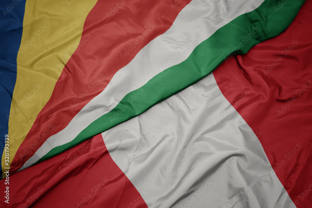 waving colorful flag of peru and national flag of seychelles.