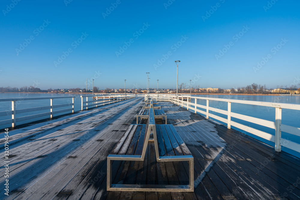 A large pier on a small lake in the city of Znin