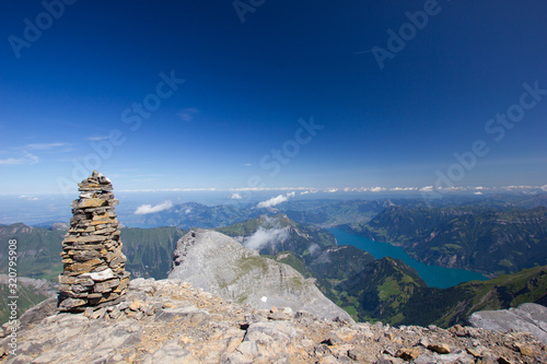 stone figure on the top of the Uri Rotstock with the lake lucerne on the right side