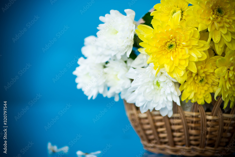 bouquet of white chrysanthemums with a greeting card for mom
