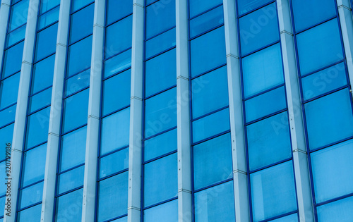 The building is made of glass. Glass facade of the building.