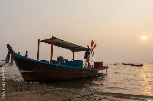 Bang Pra, Chonburi Thailand - January 18,2020 : Small Fishing boat stop at the beach in evening. © Jirattawut