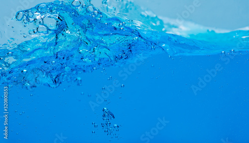 Water and air bubbles over white background with space for text.