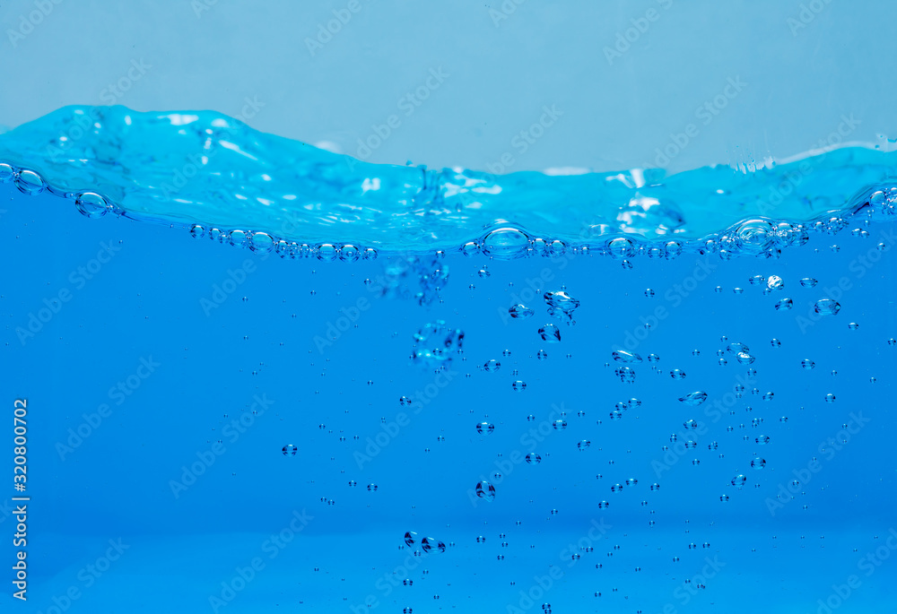 Water and air bubbles over white background with space for text. Water and air bubbles over white background with space for text.